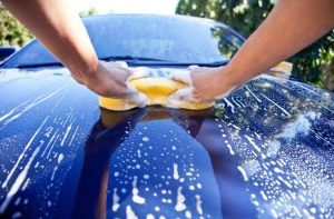 How do I wash my car properly with a car cleaning kit